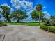 Expansive backyard with lush landscaping and scenic lake views create a serene outdoor oasis at 11226 Lane Park Rd, Tavares, FL 32778