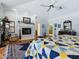 This is a primary bedroom showcasing vaulted ceilings, traditional furnishings and a fireplace at 11226 Lane Park Rd, Tavares, FL 32778