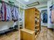 Spacious walk-in closet with custom shelving, wood floor, and plenty of room for storage at 11226 Lane Park Rd, Tavares, FL 32778