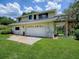 This is a two-story home with an attached two-car garage and back staircase to the second floor at 11226 Lane Park Rd, Tavares, FL 32778