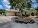 Side view of a home with a convenient driveway and an attached two-car garage at 11226 Lane Park Rd, Tavares, FL 32778
