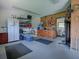 Spacious garage with ample storage, pegboard wall, and access to laundry area at 11226 Lane Park Rd, Tavares, FL 32778