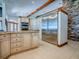 Spacious open kitchen features granite countertops, stainless steel refrigerator, tile floor, and double ovens at 11226 Lane Park Rd, Tavares, FL 32778