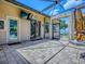 Covered patio with an outdoor TV, offering a comfortable space to relax and enjoy the views at 11226 Lane Park Rd, Tavares, FL 32778