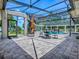 Enclosed pool and patio, offering a seamless blend of indoor and outdoor living with a lush backyard view at 11226 Lane Park Rd, Tavares, FL 32778
