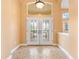 Inviting foyer showcasing decorative tile flooring and a beautiful double-door entrance at 1123 Barnacle Ter, The Villages, FL 32162
