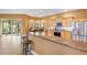 Kitchen with granite countertops, stainless steel appliances, and a bar-style eating area at 1123 Barnacle Ter, The Villages, FL 32162