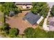 Aerial view of the property showing the house, large lot, and surrounding landscape, enclosed by a yellow property outline at 11442 Beggs Ct, Clermont, FL 34711