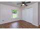 Bedroom with a ceiling fan, closet, wood floors, and natural lighting at 11442 Beggs Ct, Clermont, FL 34711