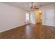Spacious bedroom featuring a ceiling fan, wood floors, and plenty of natural light at 11442 Beggs Ct, Clermont, FL 34711