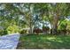 Well-maintained home with mature trees and landscaping at 11442 Beggs Ct, Clermont, FL 34711