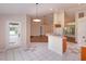 Bright kitchen featuring a breakfast bar, open layout, and an exterior door at 11442 Beggs Ct, Clermont, FL 34711