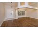 Inviting living room with a light-filled entryway, wood floors, and modern chandelier at 11442 Beggs Ct, Clermont, FL 34711