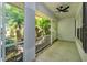 Comfortable screened-in porch with a ceiling fan, perfect for relaxing at 11442 Beggs Ct, Clermont, FL 34711