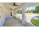 View of screened-in porch with open access to backyard and white picket fence at 11442 Beggs Ct, Clermont, FL 34711