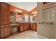 Inviting bathroom featuring dual sinks, tiled floors and decorative accents at 1304 Zombar Pl, The Villages, FL 32163