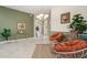 Inviting entryway with stylish seating, elegant decor, and neutral color palette at 1304 Zombar Pl, The Villages, FL 32163