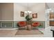 Comfortable living area features unique seating, decorative art, and modern lighting at 1304 Zombar Pl, The Villages, FL 32163