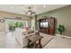 Spacious living room with a TV, open access to other rooms, and natural light at 1304 Zombar Pl, The Villages, FL 32163