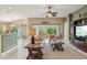 Comfortable living room featuring a large TV, stylish furniture, and an open layout at 1304 Zombar Pl, The Villages, FL 32163