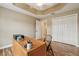 View of an office space with hardwood floors, custom desk and lots of storage at 1304 Zombar Pl, The Villages, FL 32163