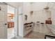 Spacious walk-in closet with open shelving and an organized storage system at 1304 Zombar Pl, The Villages, FL 32163