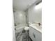 Bathroom featuring a tub with tile surround, modern vanity, and stylish fixtures at 13430 Sw 105Th Place, Dunnellon, FL 34432