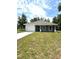Charming single-story home with a well-maintained lawn, a two-car garage, and a cozy entryway at 13430 Sw 105Th Place, Dunnellon, FL 34432