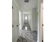 Hallway with modern flooring, fresh paint, recessed lighting, and access to bedrooms and bathrooms at 13430 Sw 105Th Place, Dunnellon, FL 34432