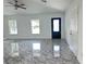 Bright living room showcasing modern flooring, fresh paint, natural light from windows, and an inviting atmosphere at 13430 Sw 105Th Place, Dunnellon, FL 34432