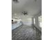 Open-concept living space with stylish flooring, recessed lighting, and seamless flow to the kitchen at 13430 Sw 105Th Place, Dunnellon, FL 34432
