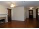 Open-concept living space with hardwood floors, a fireplace, and adjacent dining area at 1485 Morningside Dr, Mount Dora, FL 32757