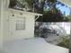 Cozy outdoor patio with table and chairs, perfect for enjoying the garden view at 1485 Morningside Dr, Mount Dora, FL 32757