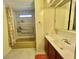 Full bathroom featuring a tub/shower combination with bright lighting and vanity at 152 Dogwood Trl, Leesburg, FL 34748