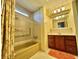 Full bathroom featuring a tub/shower combination with bright lighting and vanity at 152 Dogwood Trl, Leesburg, FL 34748