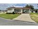 Charming single-story home with well-maintained lawn and covered carport at 152 Dogwood Trl, Leesburg, FL 34748