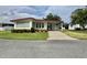 Attractive home with manicured lawn and convenient covered parking at 152 Dogwood Trl, Leesburg, FL 34748