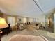 Spacious living room featuring a sectional sofa, neutral colors, and natural light at 152 Dogwood Trl, Leesburg, FL 34748