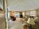 Cozy living room featuring comfortable furniture, natural light, and neutral tones at 152 Dogwood Trl, Leesburg, FL 34748