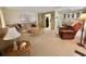 Cozy living room with comfortable seating, neutral decor, and plenty of space at 152 Dogwood Trl, Leesburg, FL 34748