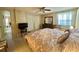Main bedroom features two windows, a ceiling fan and two double closets at 152 Dogwood Trl, Leesburg, FL 34748