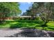 Charming single-story home with mature landscaping and large trees in a serene neighborhood setting at 15935 J And J Dr, Tavares, FL 32778