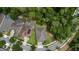 Aerial view showcases the home's location amidst lush greenery and well-maintained surroundings at 179 Birchmont Dr, Deland, FL 32724