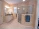 Bathroom featuring granite vanity, white cabinets and a glass-enclosed shower at 179 Birchmont Dr, Deland, FL 32724