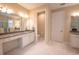 Bathroom featuring double vanity with granite countertop, white cabinets, and toilet room at 179 Birchmont Dr, Deland, FL 32724