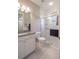Bright bathroom features a glass-enclosed shower and granite countertops at 179 Birchmont Dr, Deland, FL 32724