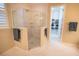 Bathroom featuring a large glass-enclosed shower with seating and access to the walk-in closet at 179 Birchmont Dr, Deland, FL 32724