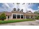 The exterior of the Victoria Hills Golf Club featuring a large lawn and parking at 179 Birchmont Dr, Deland, FL 32724