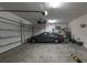 Spacious garage featuring ample storage, organization, and a parked car at 179 Birchmont Dr, Deland, FL 32724