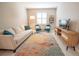 Cozy living room featuring modern furnishings, a bright window, and stylish decor at 179 Birchmont Dr, Deland, FL 32724